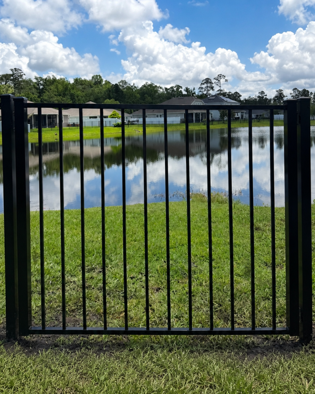 Black aluminum fence gate for a Jacksonville, FL home
