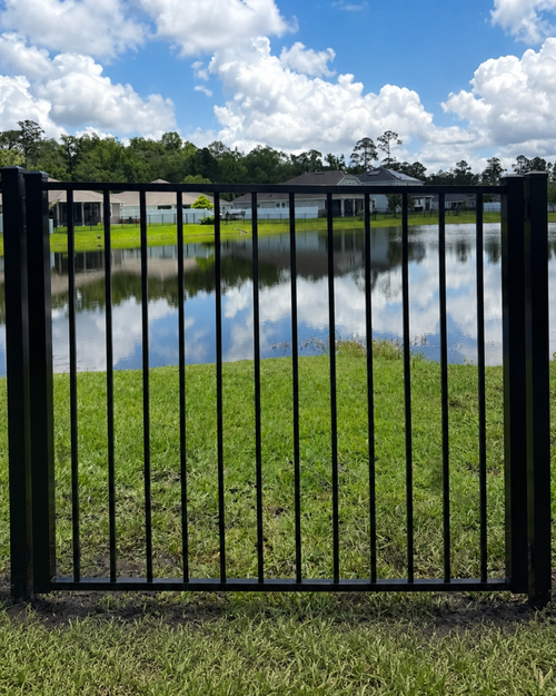 Black aluminum fence gate for a Jacksonville, FL home