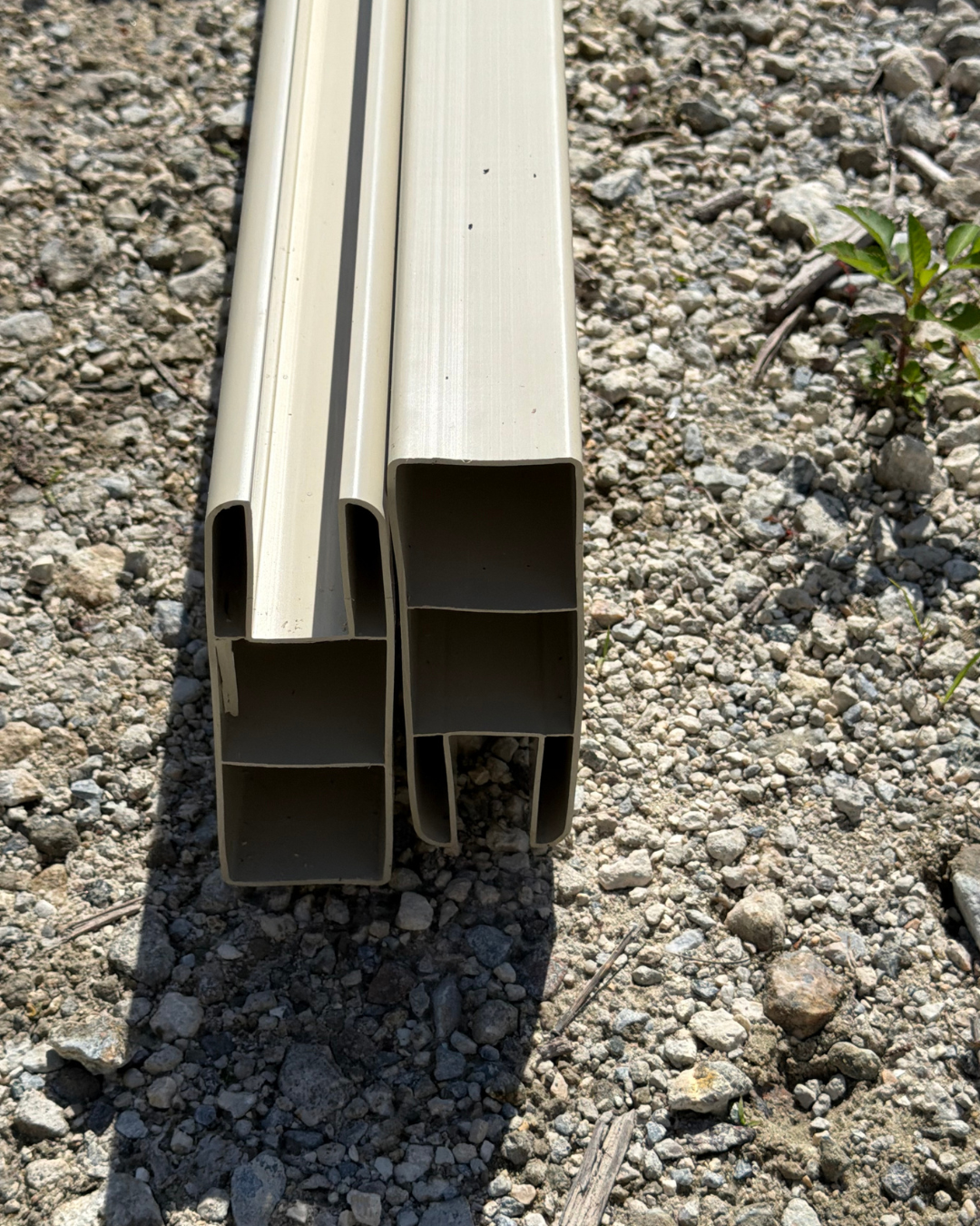 Tan vinyl privacy fence rails, top and bottom pair